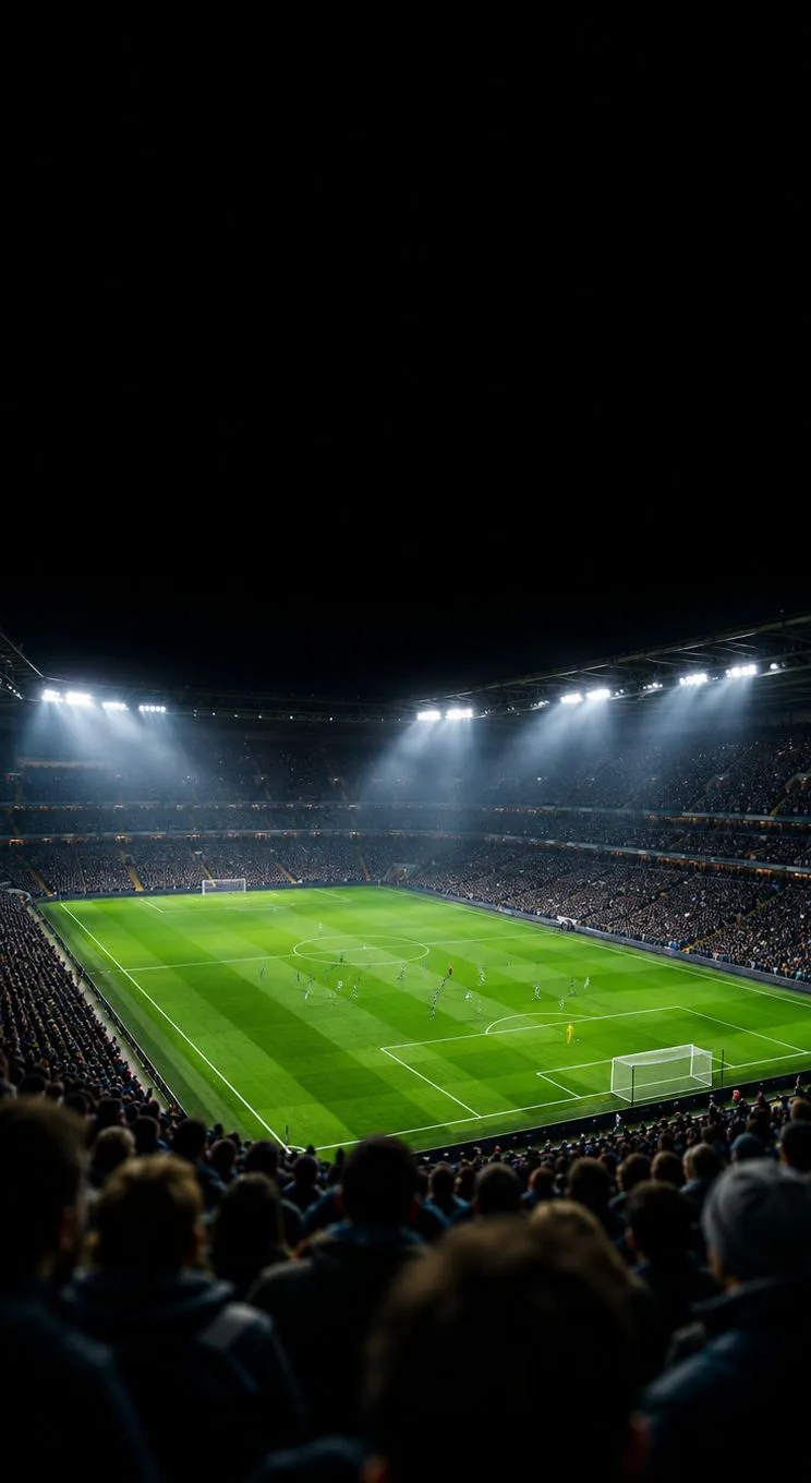 Un stade de football la nuit sous les projecteurs, vu depuis les tribunes